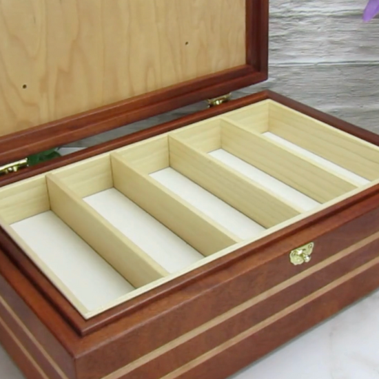 Video showing details of children's memory box with photo lid handmade from mahogany, cherry, and maple burl veneer by A Finer Cut Woodworking. 