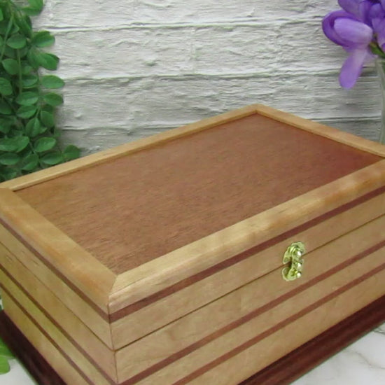 Video showing details of handmade wood jewelry box crafted from cherry with Brazilian cherry inlays by A Finer Cut Woodwork.