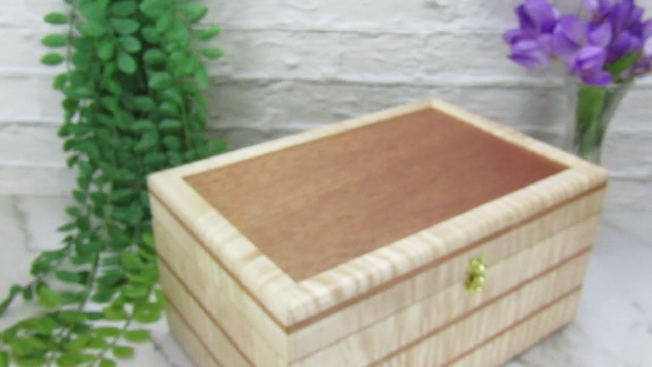 Video showing details of  wooden memory box handmade from curly maple and cherry wood by A Finer Cut Woodworking.