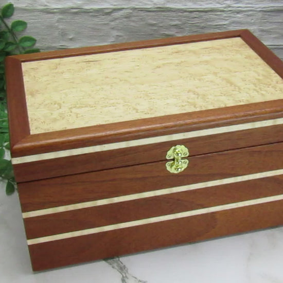 Video showing details of large memory box handmade from Honduran mahogany with curly maple inlays by A Finer Cut Woodworking.