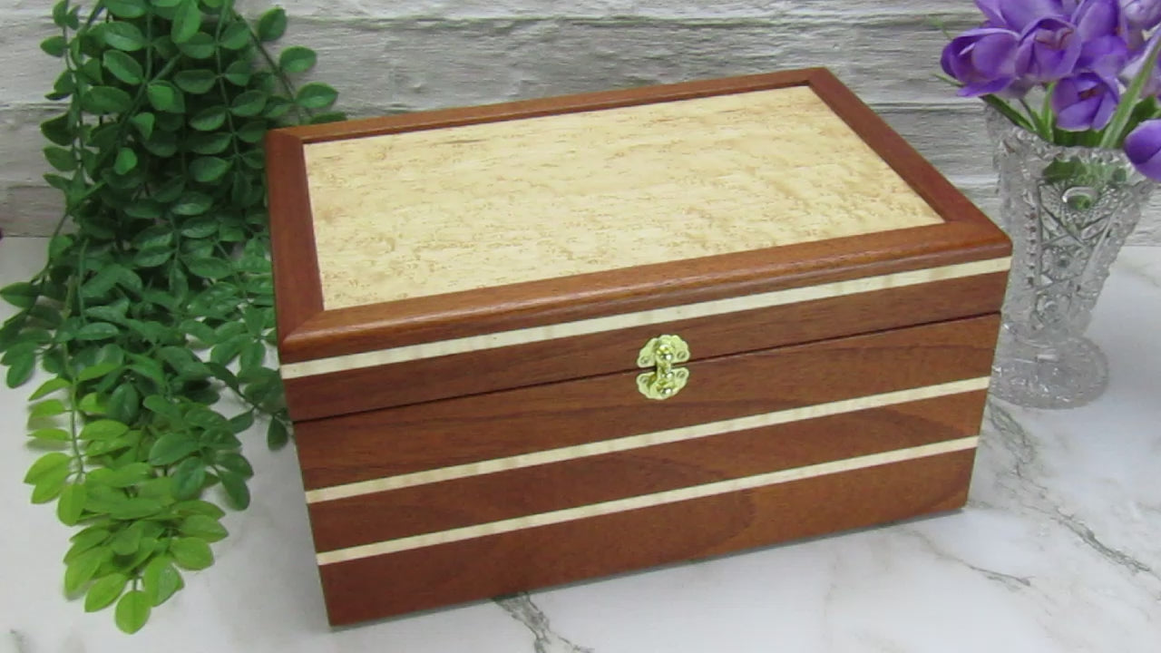 Video showing details of large memory box handmade from Honduran mahogany with curly maple inlays by A Finer Cut Woodworking.