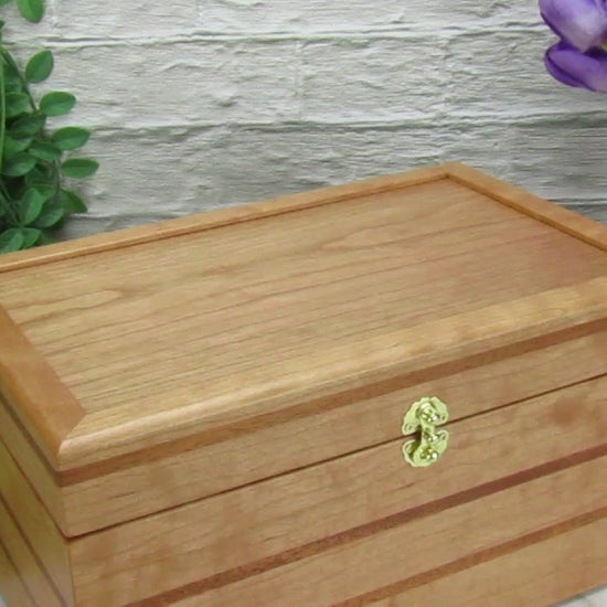 Video showing details of large keepsake box handmade from cherry, mahogany, and cherry veneer by A Finer Cut Woodworking.
