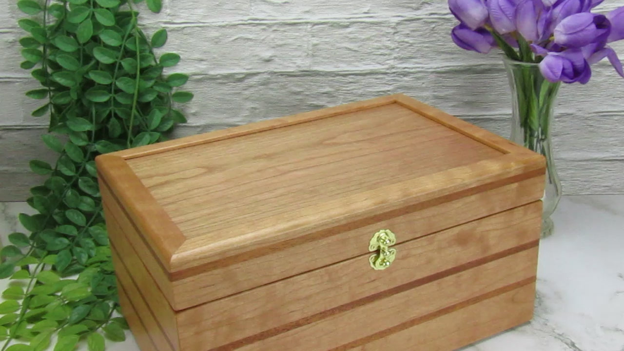 Video showing details of large keepsake box handmade from cherry, mahogany, and cherry veneer by A Finer Cut Woodworking.