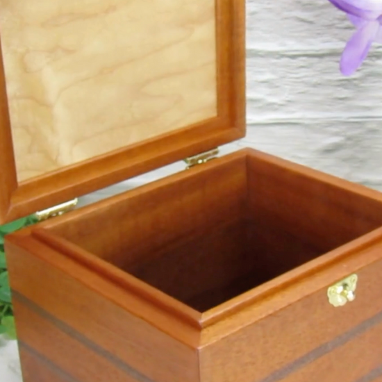 Video showing details of keepsake memory box handmade from mahogany, walnut, and dark finished cherry veneer by A Finer Cut Woodworking.