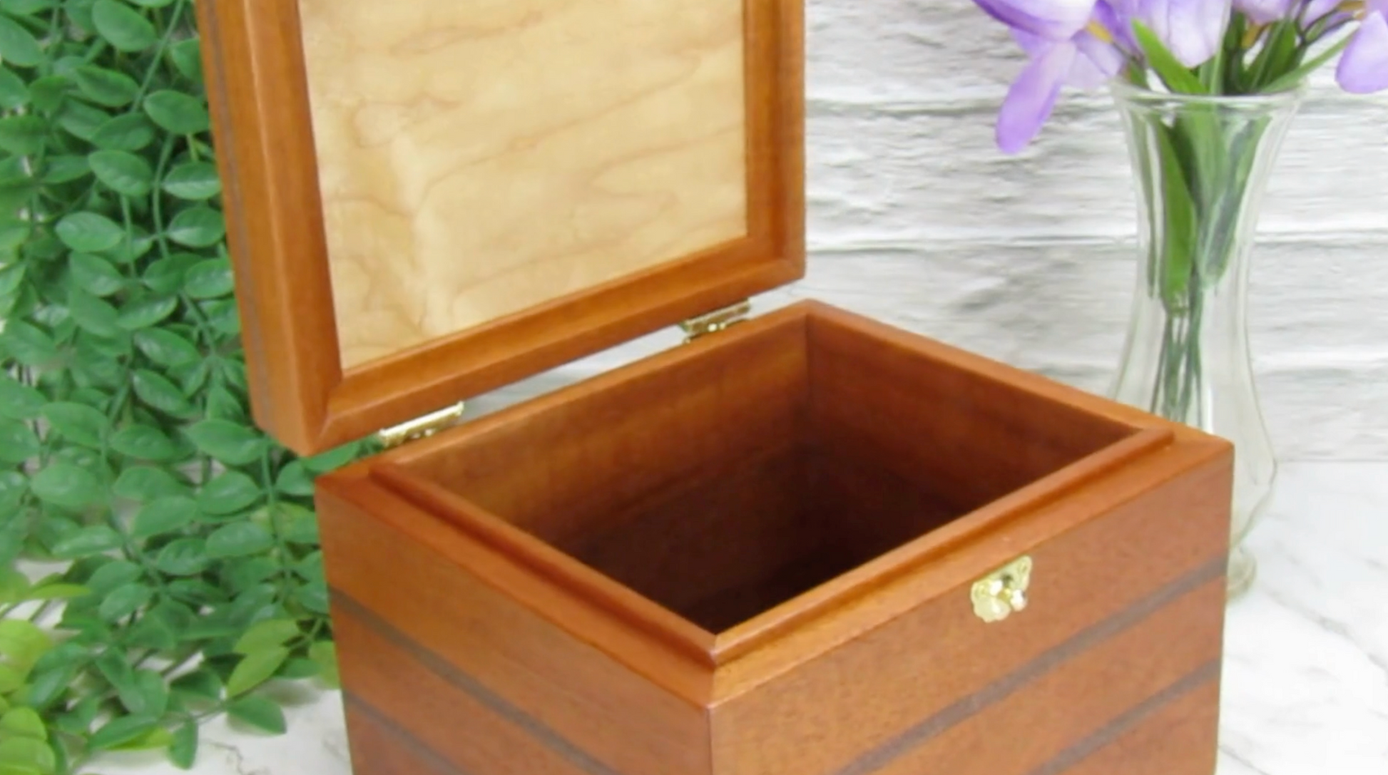 Video showing details of keepsake memory box handmade from mahogany, walnut, and dark finished cherry veneer by A Finer Cut Woodworking.