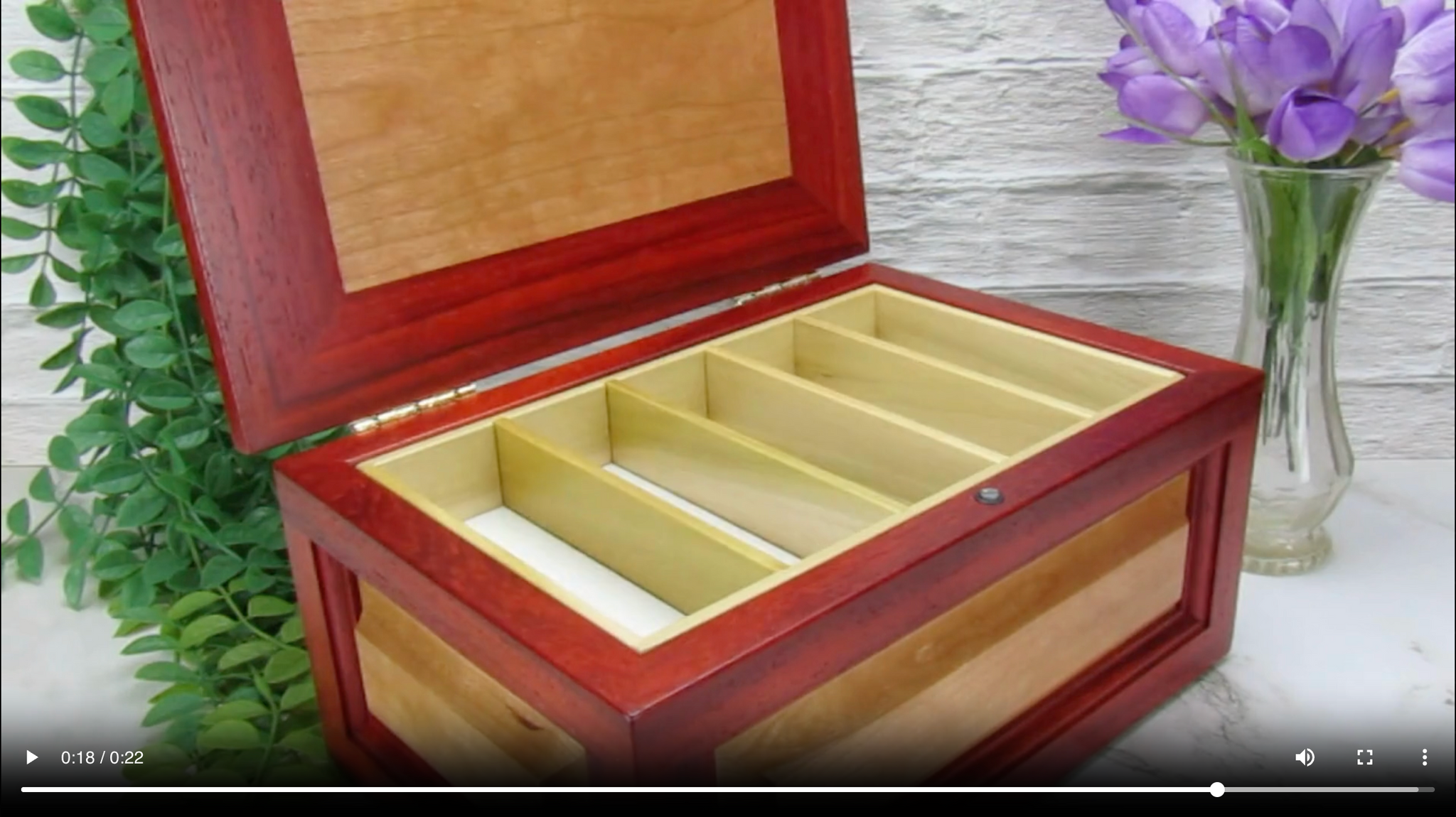Video showing details of large keepsake box with raised panels handcrafted from padauk and cherry wood by A Finer Cut.