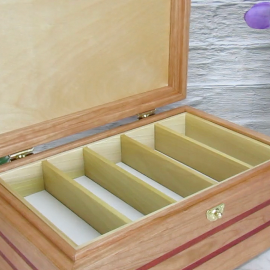 Video showing details of unique memorial box handcrafted from domestic cherry, padauk, and dark finished cherry veneer by A Finer Cut Woodworking. 