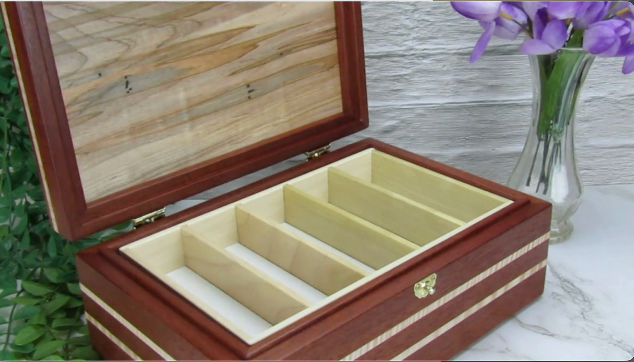 Video showing details of unique memorial box handcrafted from Honduran mahogany, curly maple, and ambrosia maple by A Finer Cut Woodworking.