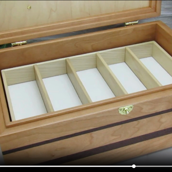 Video showing details of memory box with photo lid handcrafted from cherry, wenge, and mahogany burl veneer by A Finer Cut Woodworking. 