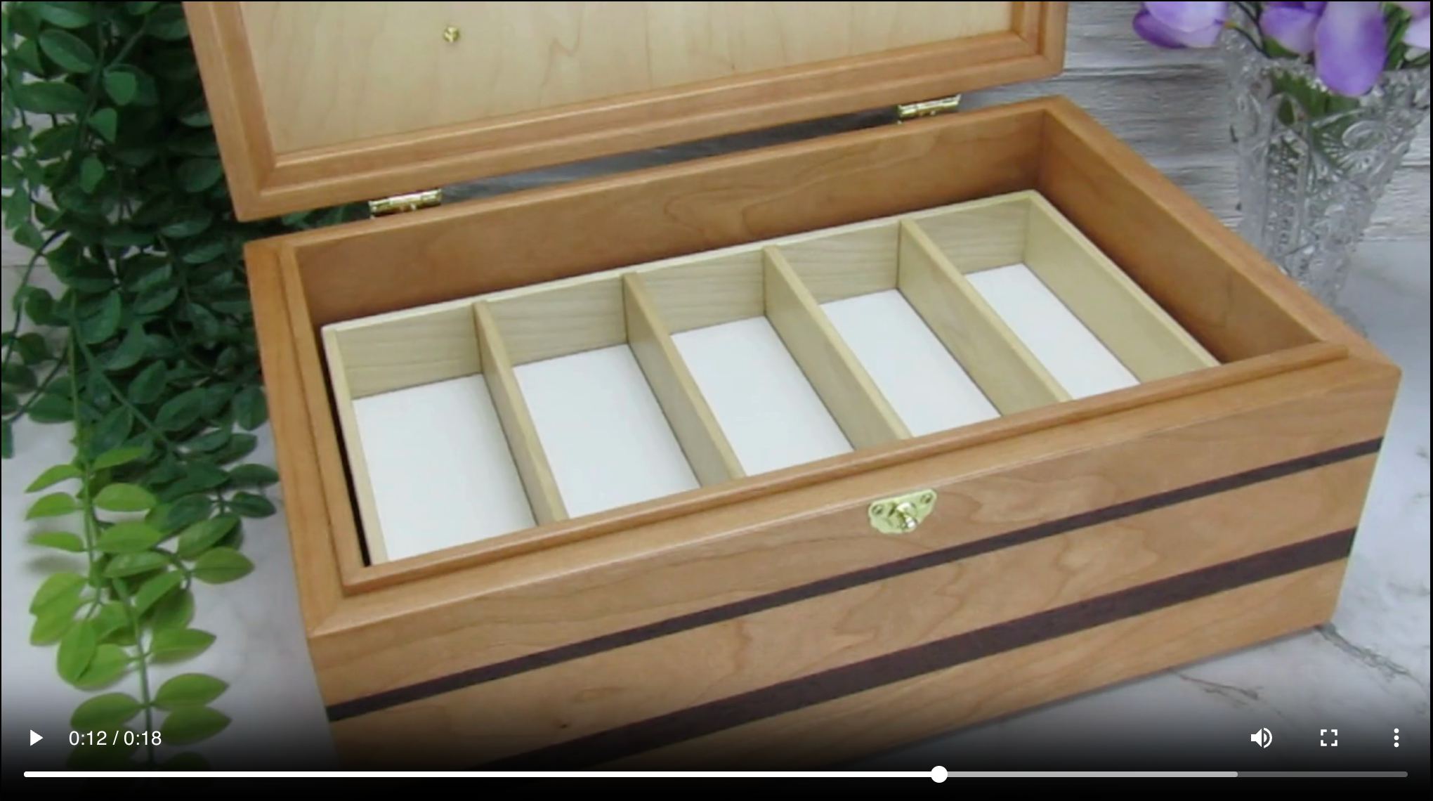 Video showing details of memory box with photo lid handcrafted from cherry, wenge, and mahogany burl veneer by A Finer Cut Woodworking. 
