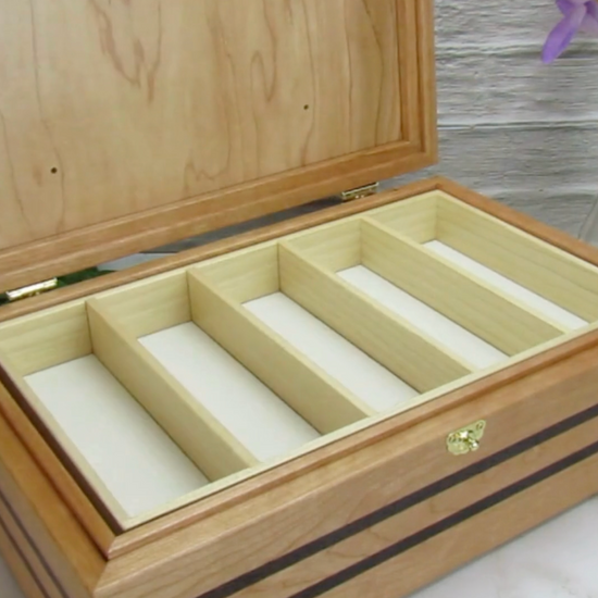 Video showing details of pet memorial box handmade from cherry, wenge, and walnut burl veneer by A Finer Cut Woodworking.