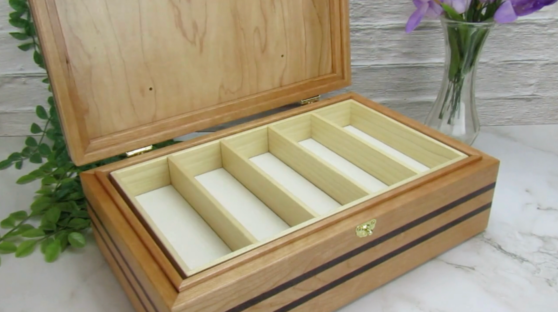 Video showing details of pet memorial box handmade from cherry, wenge, and walnut burl veneer by A Finer Cut Woodworking.