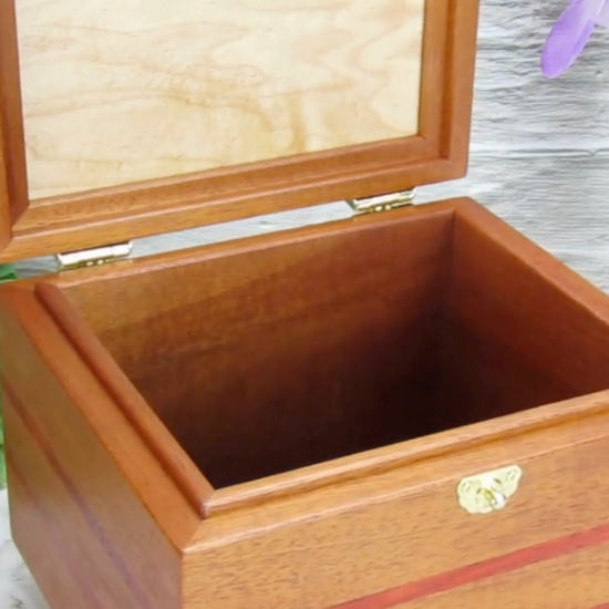 Video showing details of unique small keepsake box handmade from mahogany, padauk, and red finished cherry veneer by A Finer Cut Woodworking.