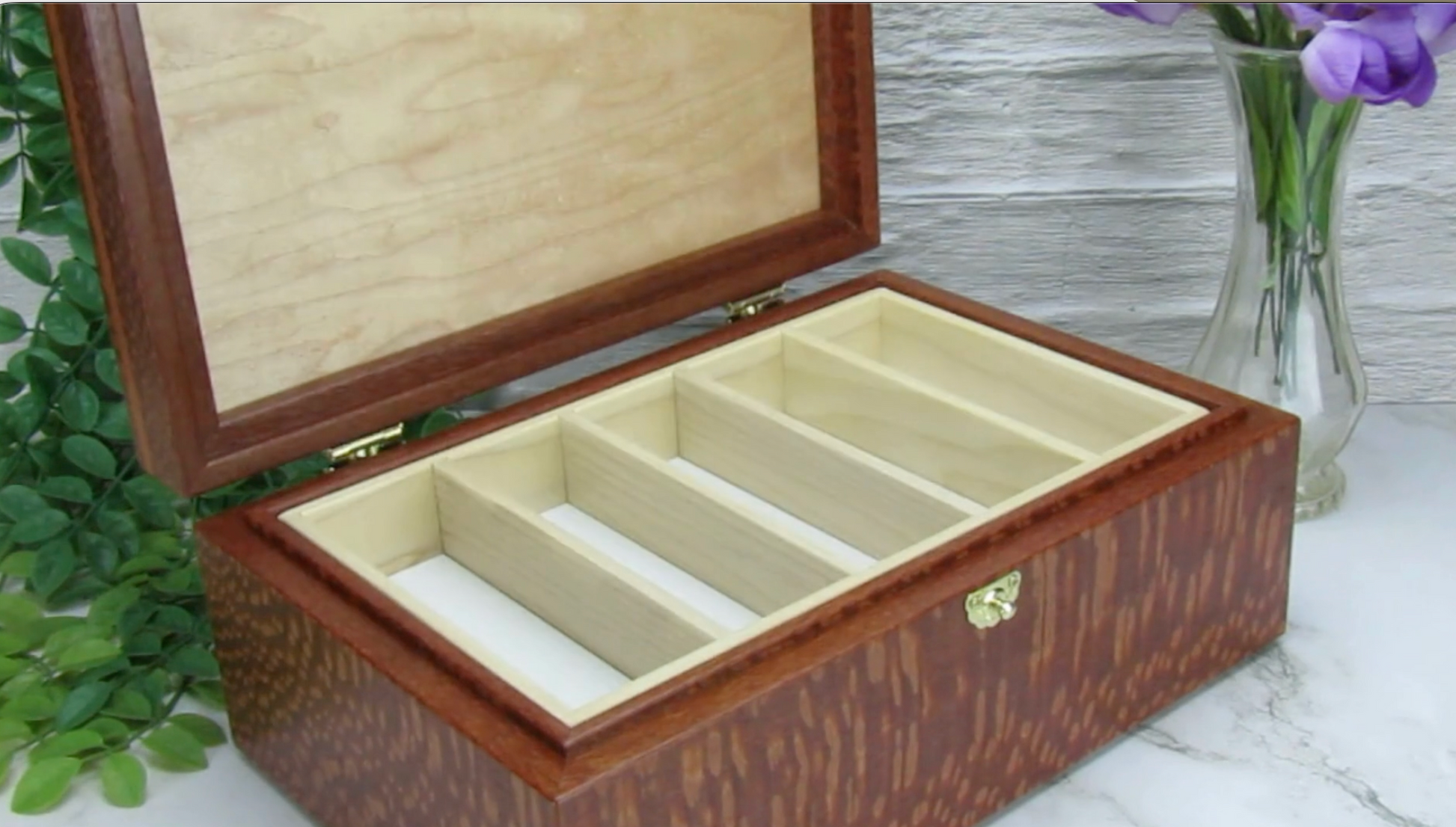 Video showing details of valet box for men handcrafted from leopardwood with mahogany inlay by A Finer Cut Woodworking.