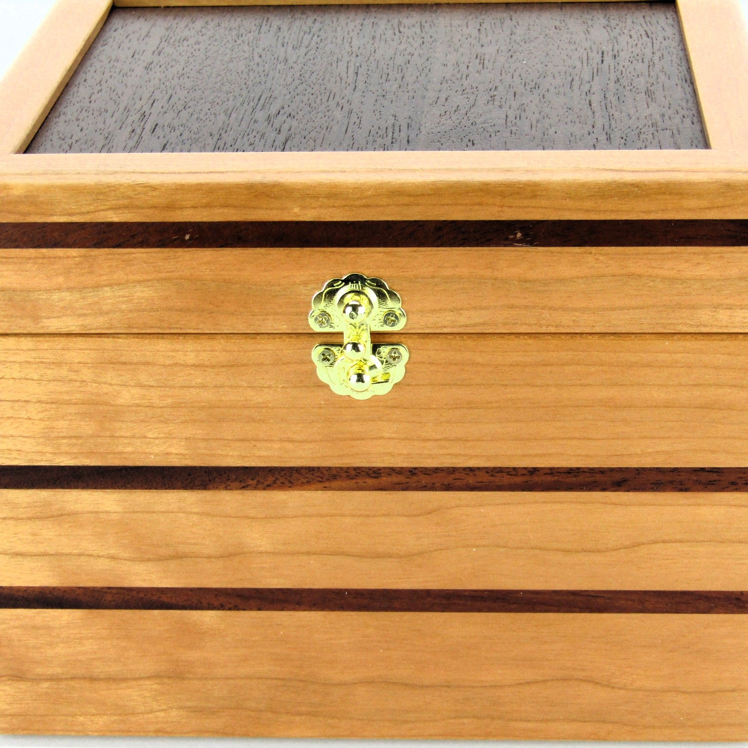 Inlays on unique small keepsake box handmade from cherry, mahogany and Peruvian walnut wood by A Finer Cut.
