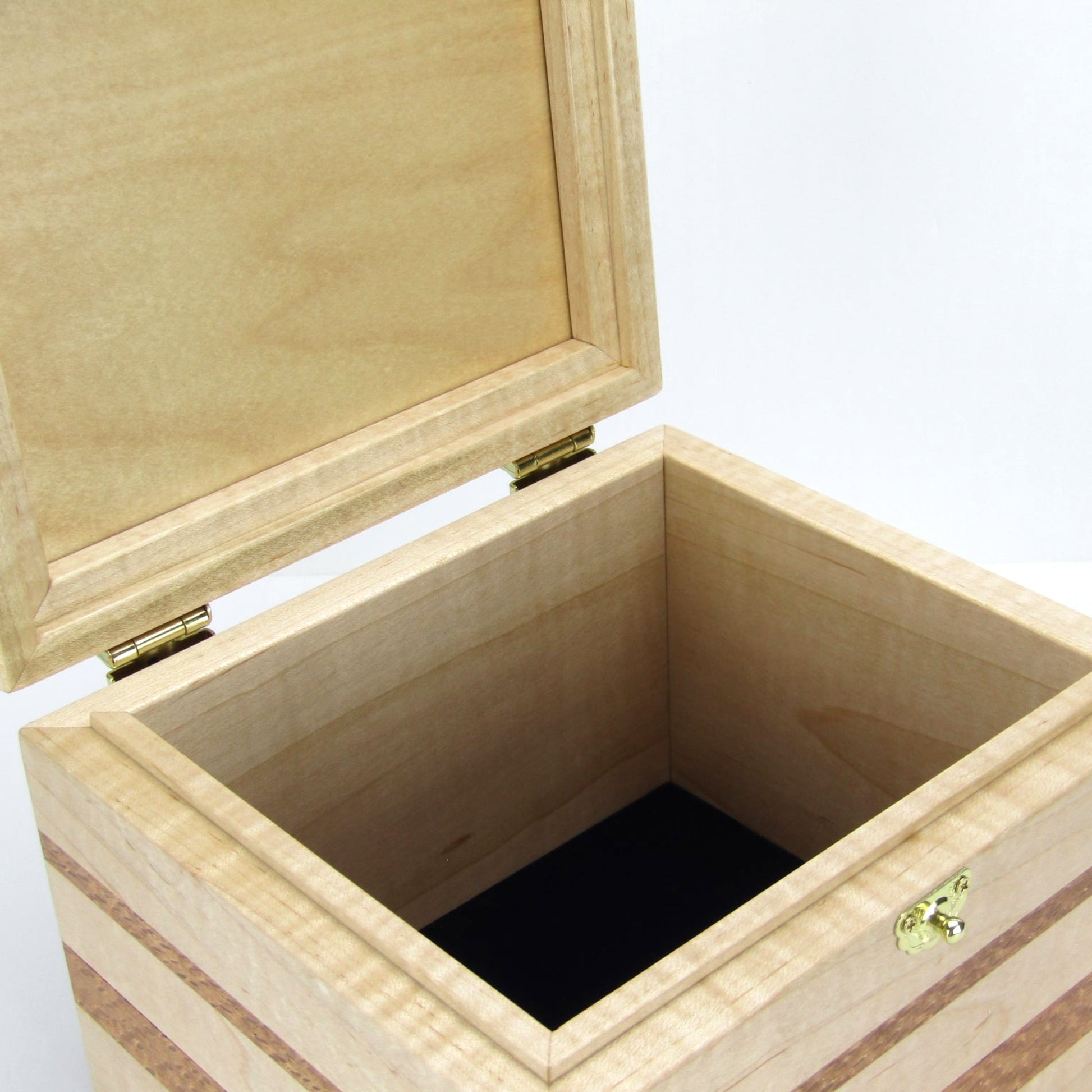 Interior view of unique small keepsake box handmade from curly maple and lacewood by A Finer Cut Woodworking. 