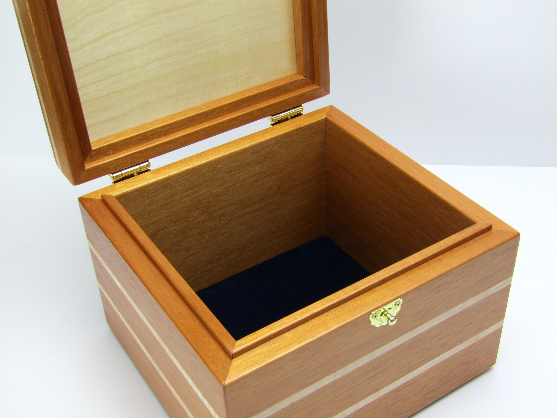 Interior view of unique small keepsake box handmade from mahogany and maple wood by A Finer Cut Woodworking. 