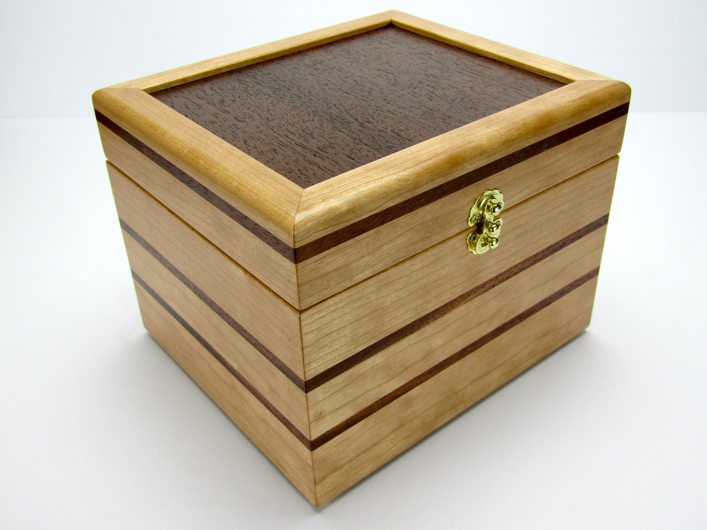 Front view of unique small keepsake box handmade from cherry, mahogany and Peruvian walnut wood by A Finer Cut.