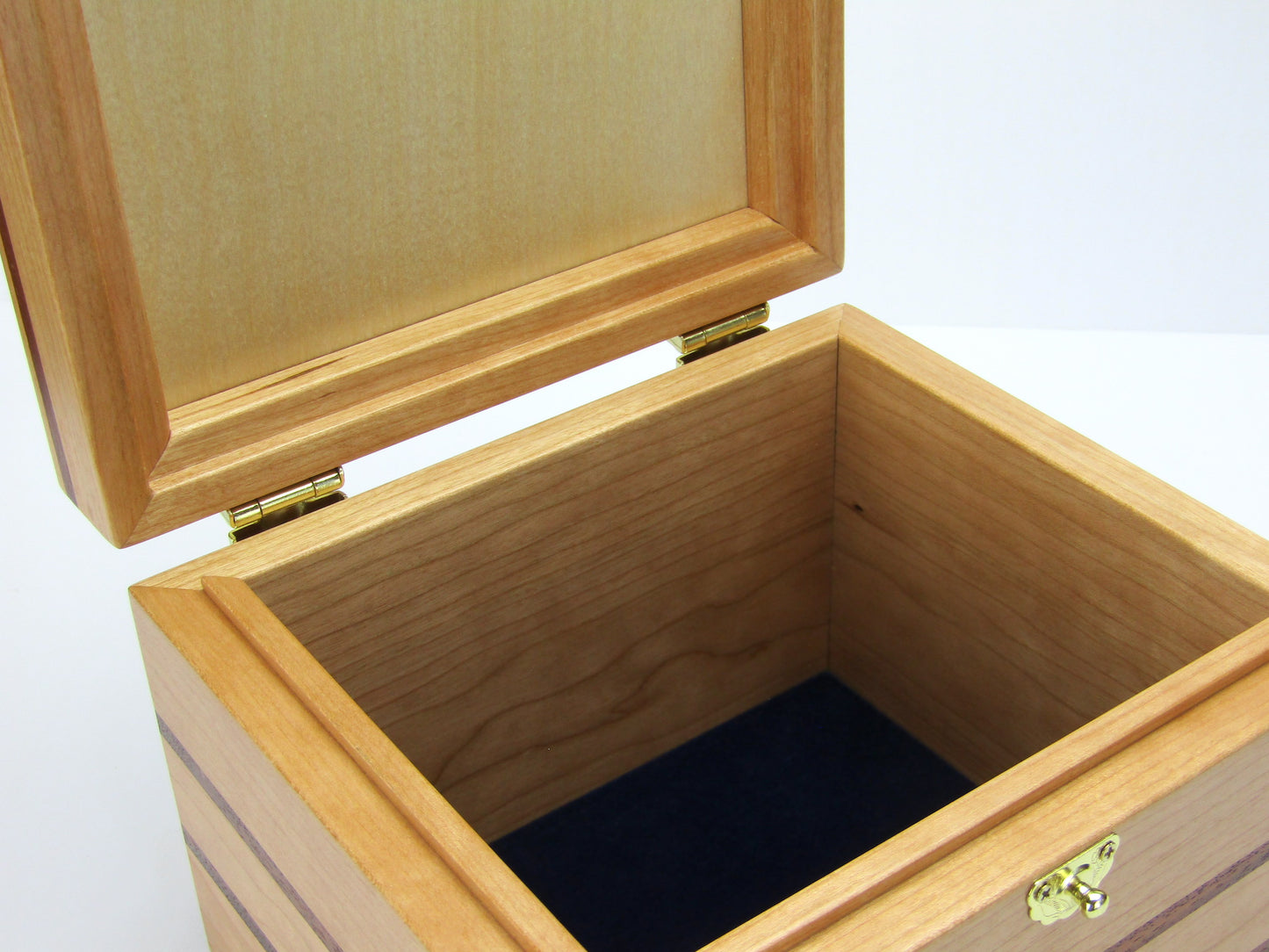 Interior view of unique small keepsake box handmade from cherry, mahogany and Peruvian walnut wood by A Finer Cut.