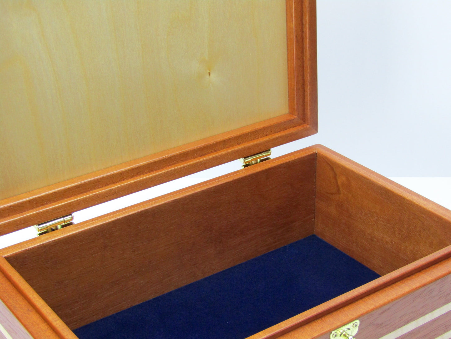 Interior view of valet box for men handcrafted from mahogany, curly and maple wood by A Finer Cut Wood.