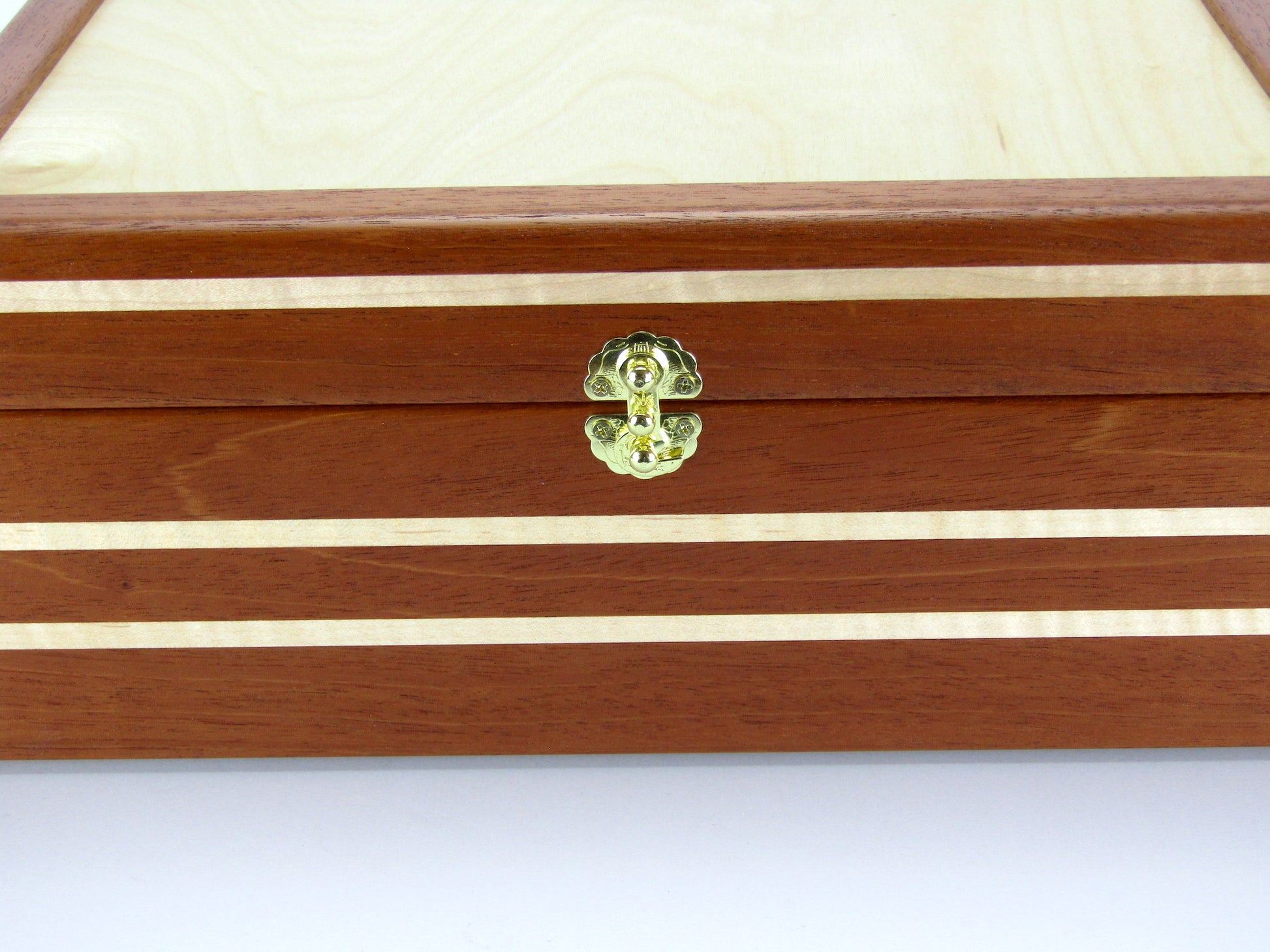 Inlays on valet box for men handcrafted from mahogany, curly and maple wood by A Finer Cut Wood.