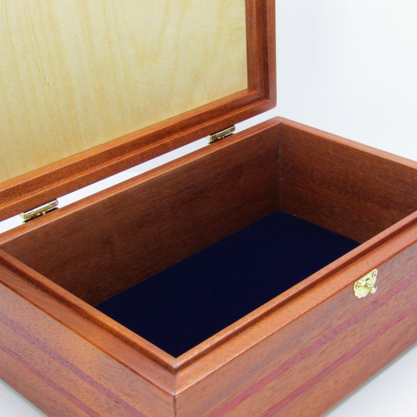 Interior view of valet box for men handcrafted from mahogany with padauk wood inlays by A Finer Cut Woodworking.