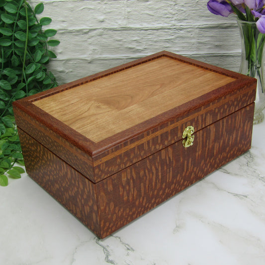 Thumbnail of valet box for men handcrafted from leopardwood with mahogany inlay by A Finer Cut Woodworking.