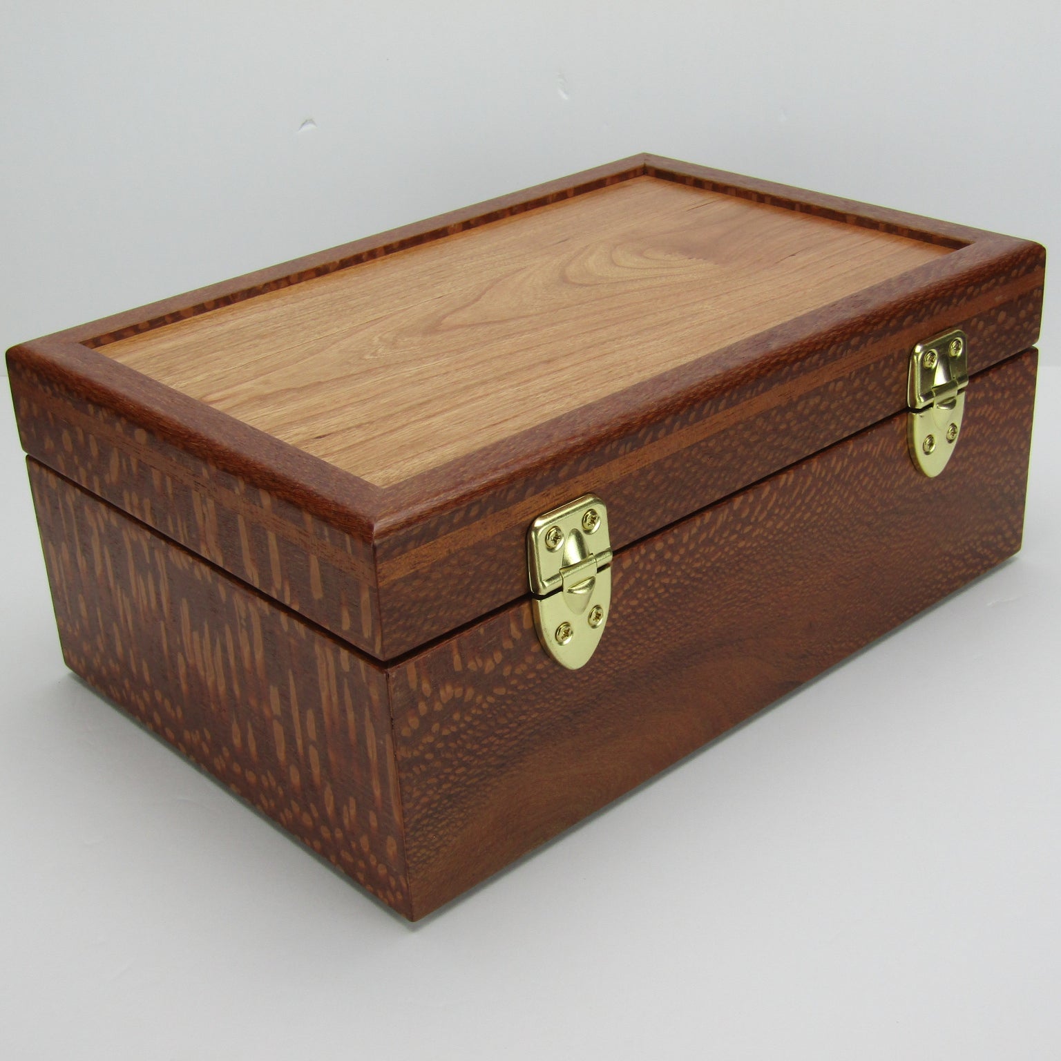 Back view of valet box for men handcrafted from leopardwood with mahogany inlay by A Finer Cut Woodworking.