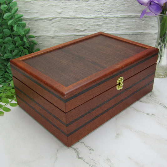 Thumbnail of valet box for men handcrafted from mahogany, with wenge inlay and a dark finished cherry veneer lid  by A Finer Cut Woodworking.