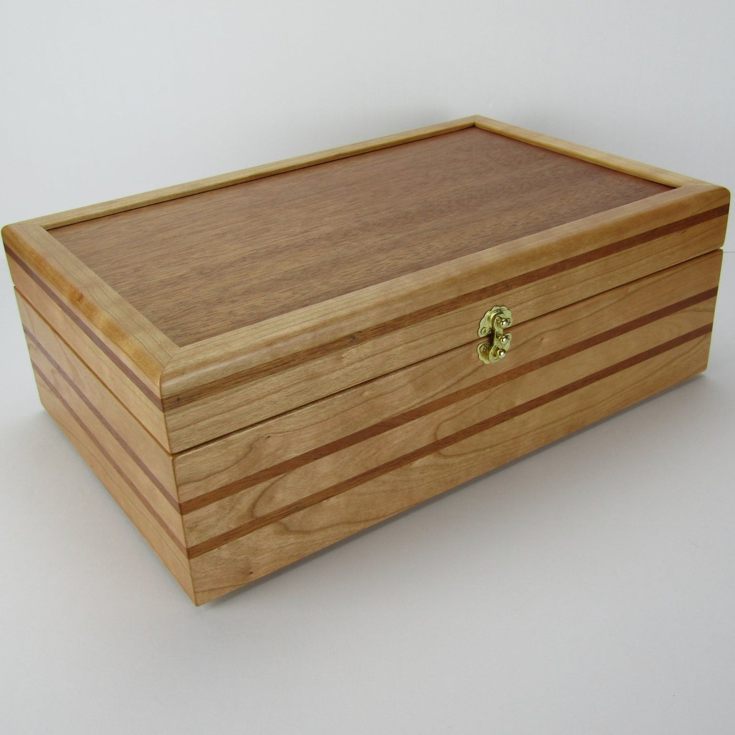Full view corner of wooden keepsake box handmade from domestic cherry and mahogany wood by A Finer Cut Woodworking.