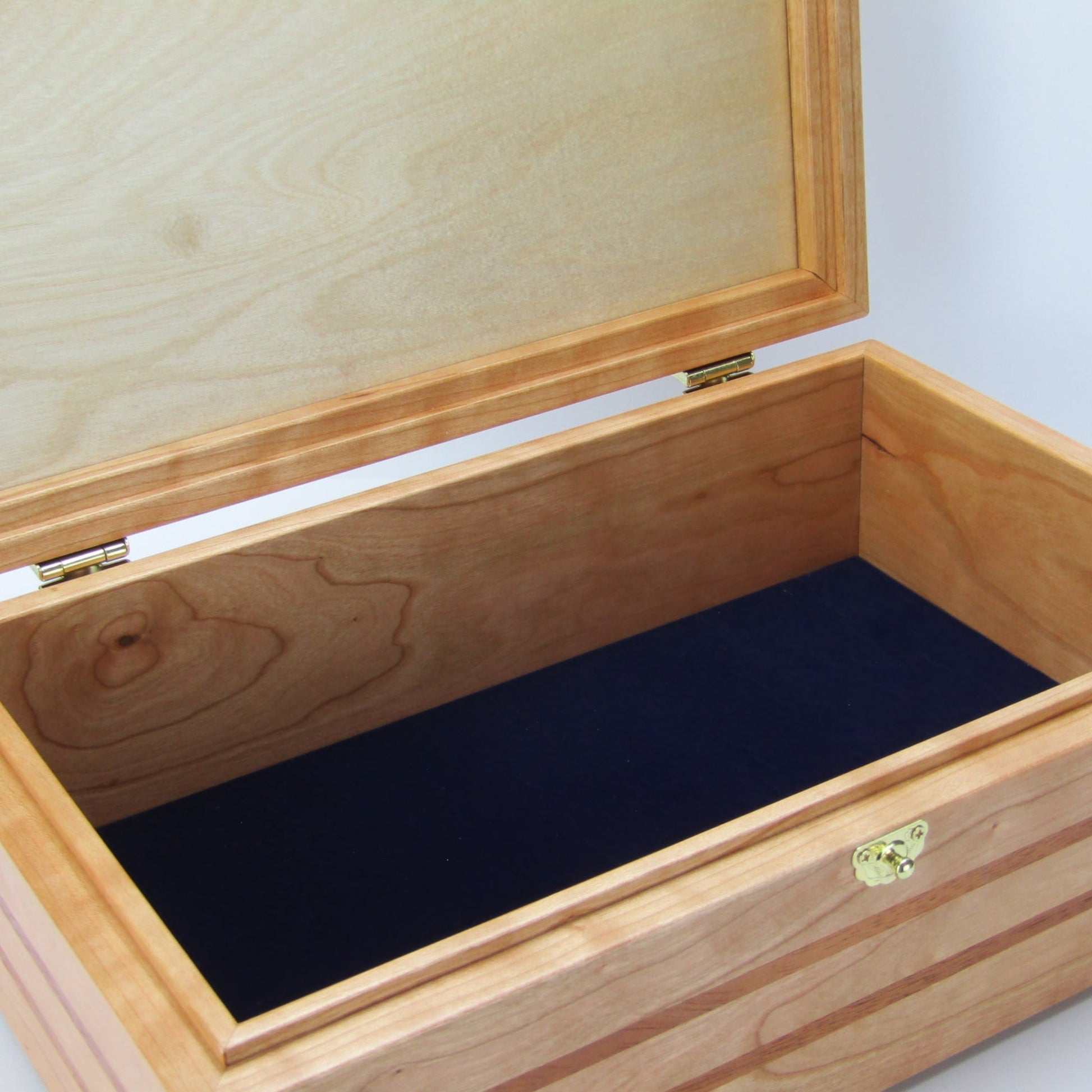 Interior view of wooden keepsake box handmade from domestic cherry and mahogany wood by A Finer Cut Woodworking.