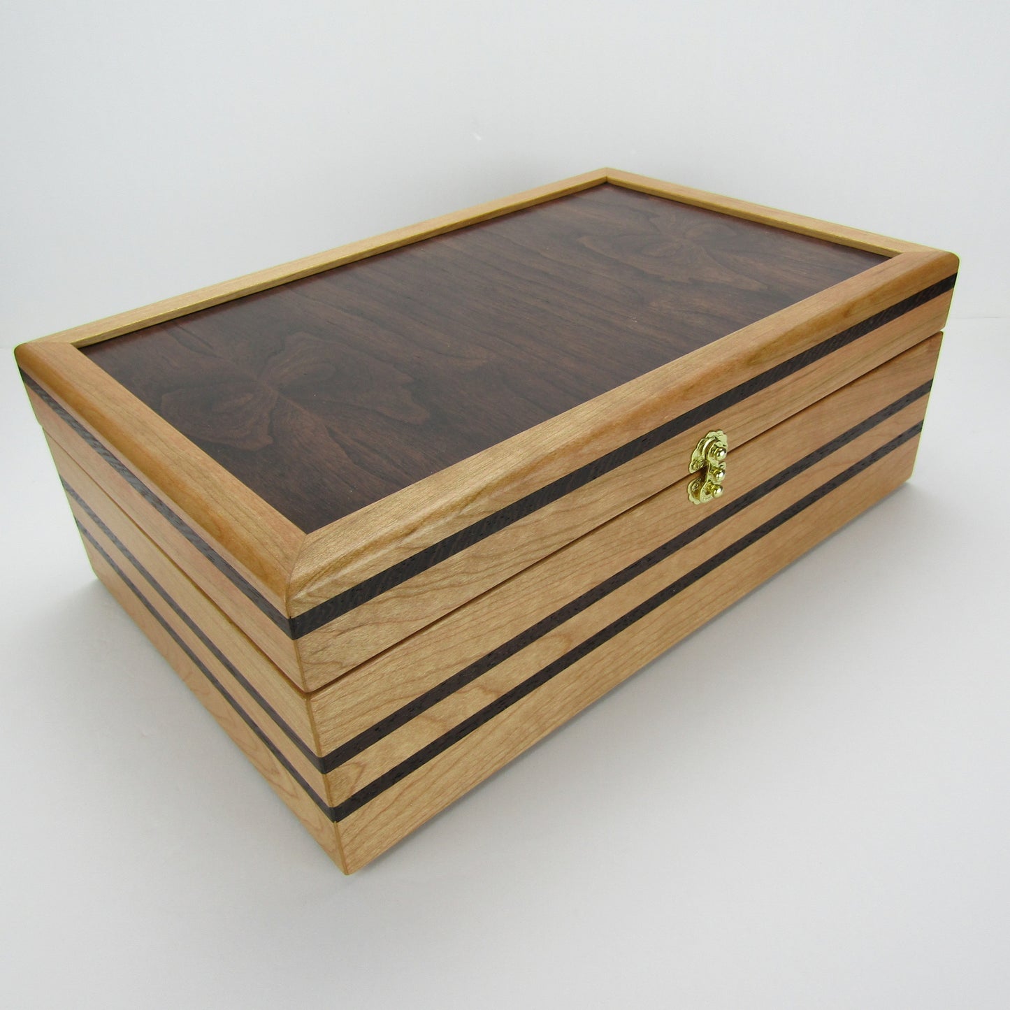 >Front corner view of wooden keepsake box handmade from cherry, wenge, and dark finished cherry veneer by A Finer Cut Woodworking.