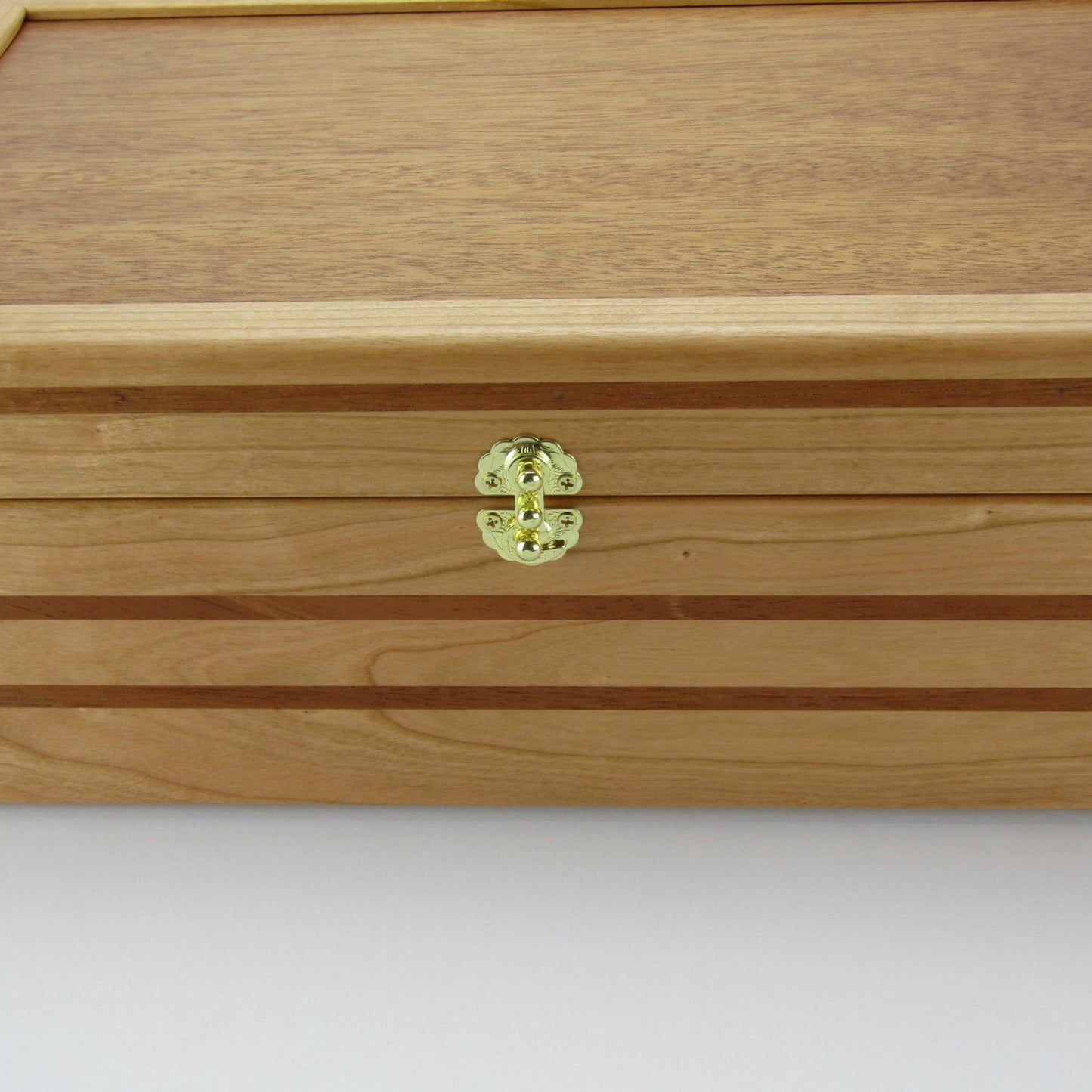 Front view of wooden keepsake box handmade from domestic cherry and mahogany wood by A Finer Cut Woodworking.