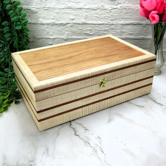 Thumbnail of wooden keepsake box handmade from curly maple, mahogany, and cherry veneer by A Finer Cut Woodworking.