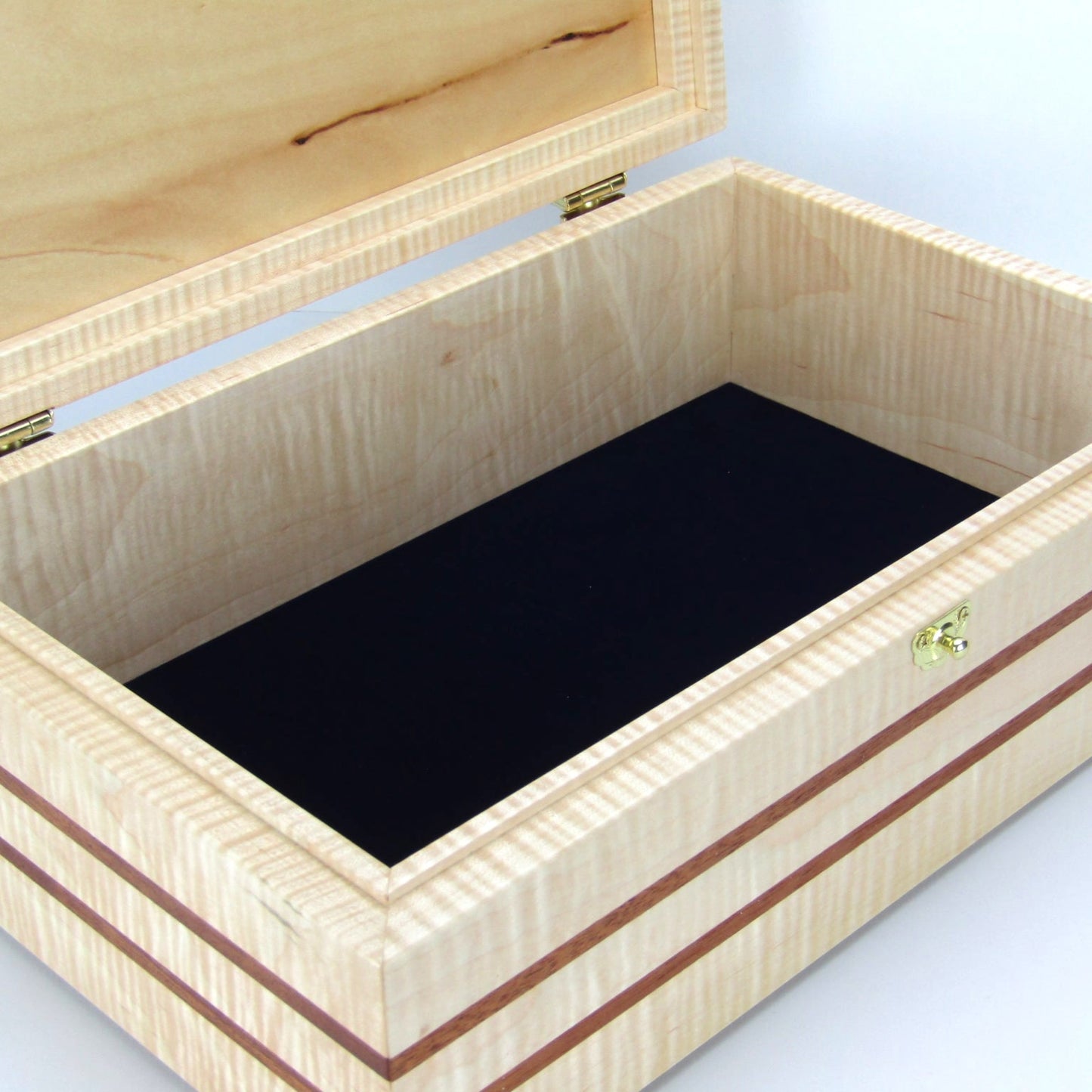 Interior view of wooden keepsake box handmade from curly maple, mahogany, and cherry veneer by A Finer Cut Woodworking.