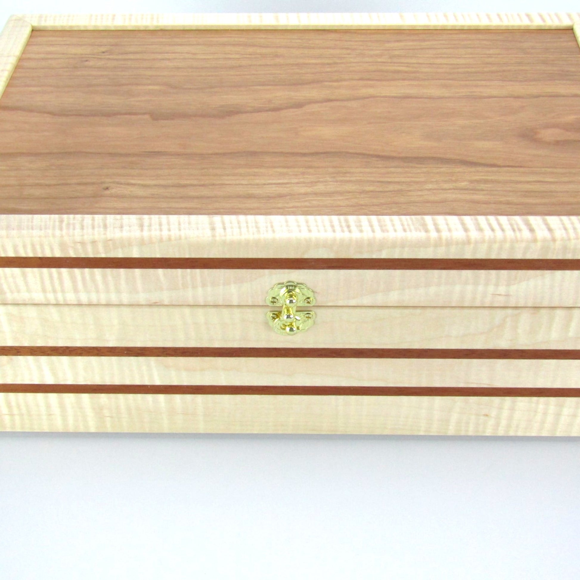 Top view of wooden keepsake box handmade from curly maple, mahogany, and cherry veneer by A Finer Cut Woodworking.