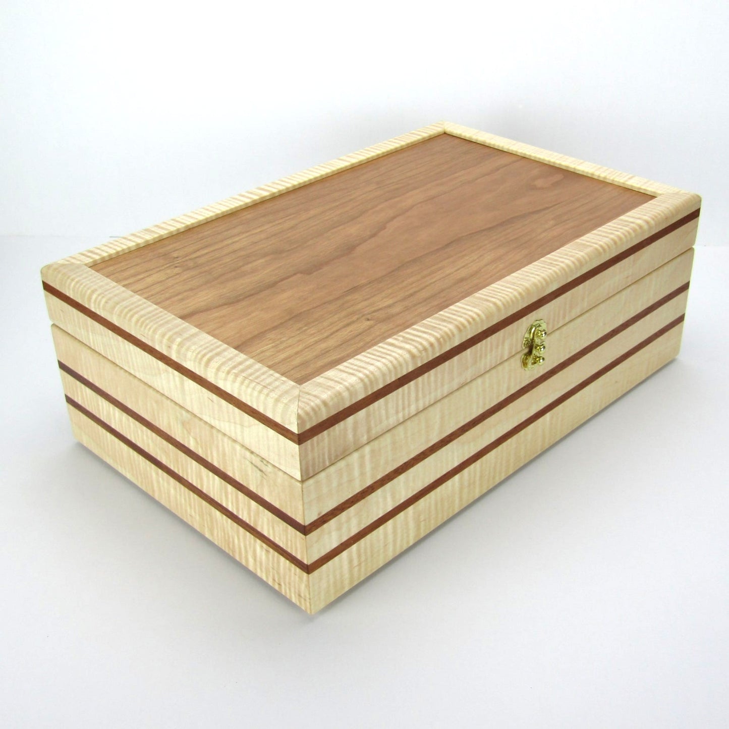 Full view corner of wooden keepsake box handmade from curly maple, mahogany, and cherry veneer by A Finer Cut Woodworking.