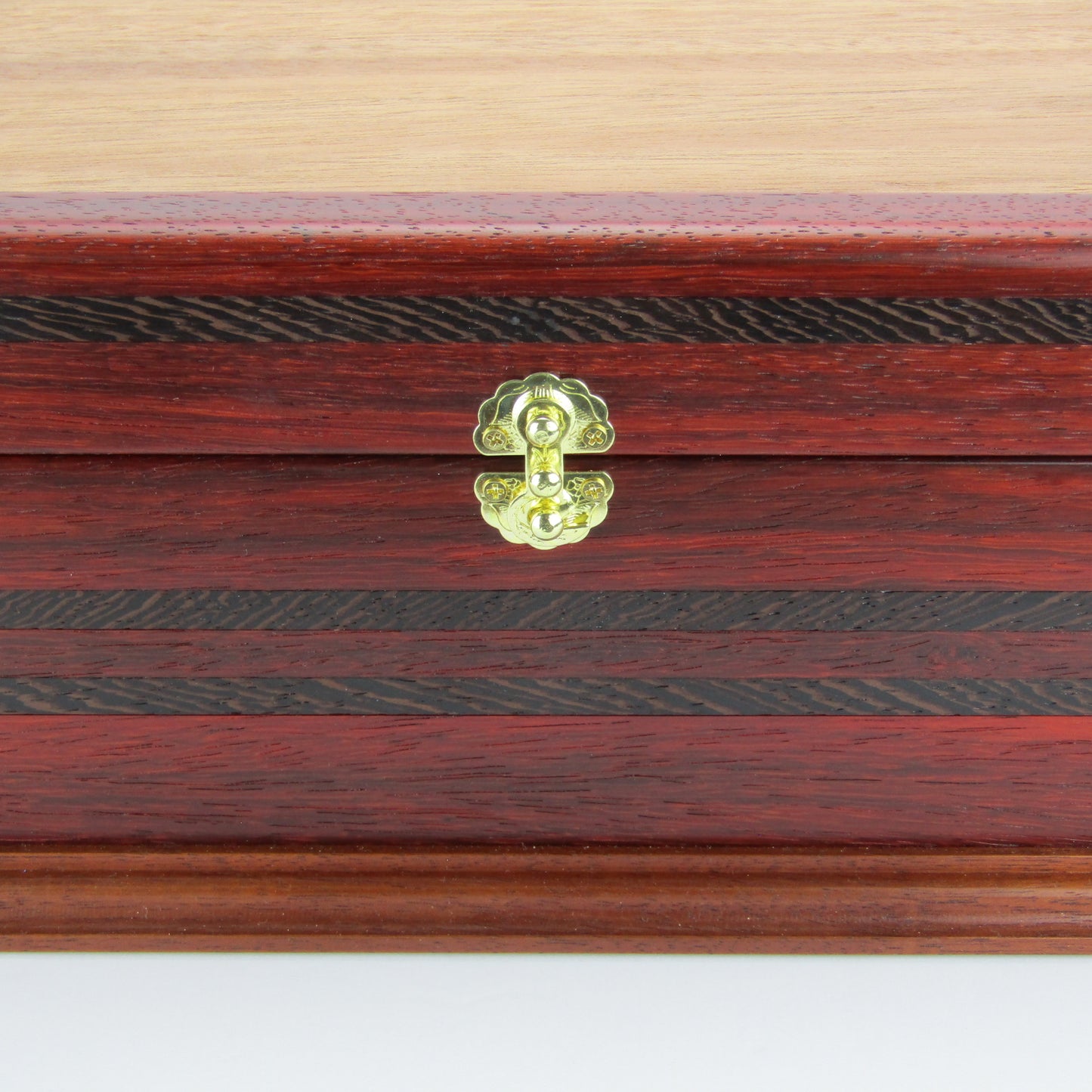 Front view of wooden keepsake box handmade from padauk, wenge, and cherry veneer by A Finer Cut Woodworking.