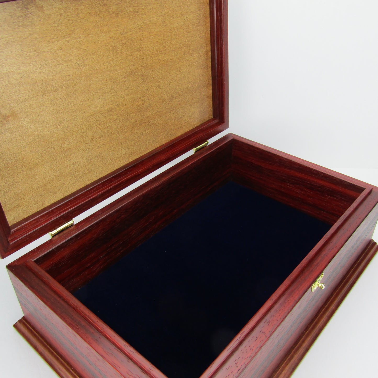 Interior view of wooden keepsake box handmade from padauk, wenge, and cherry veneer by A Finer Cut Woodworking.