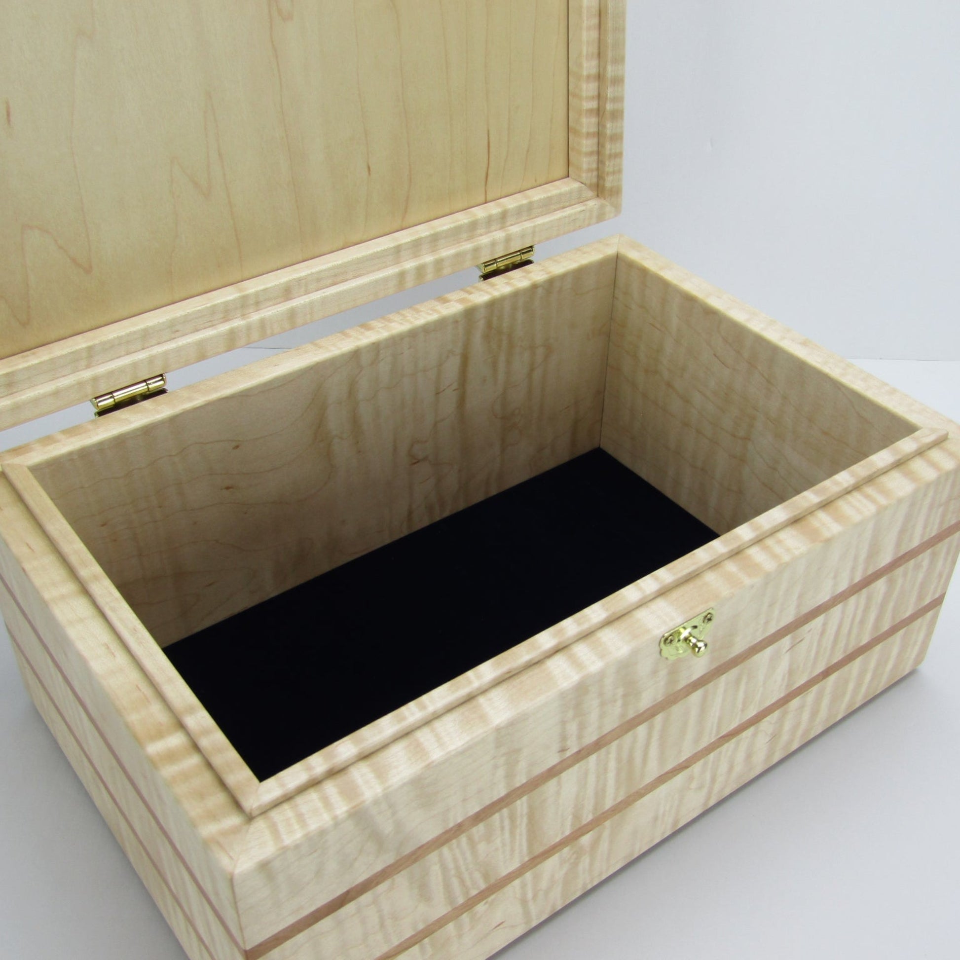 Interior view of wooden memory box handmade from curly maple and cherry wood by A Finer Cut Woodworking.